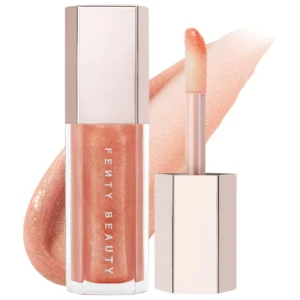 Fenty Beauty Gloss Bomb Universal Lip Luminizer in shimmering nude pink on white background